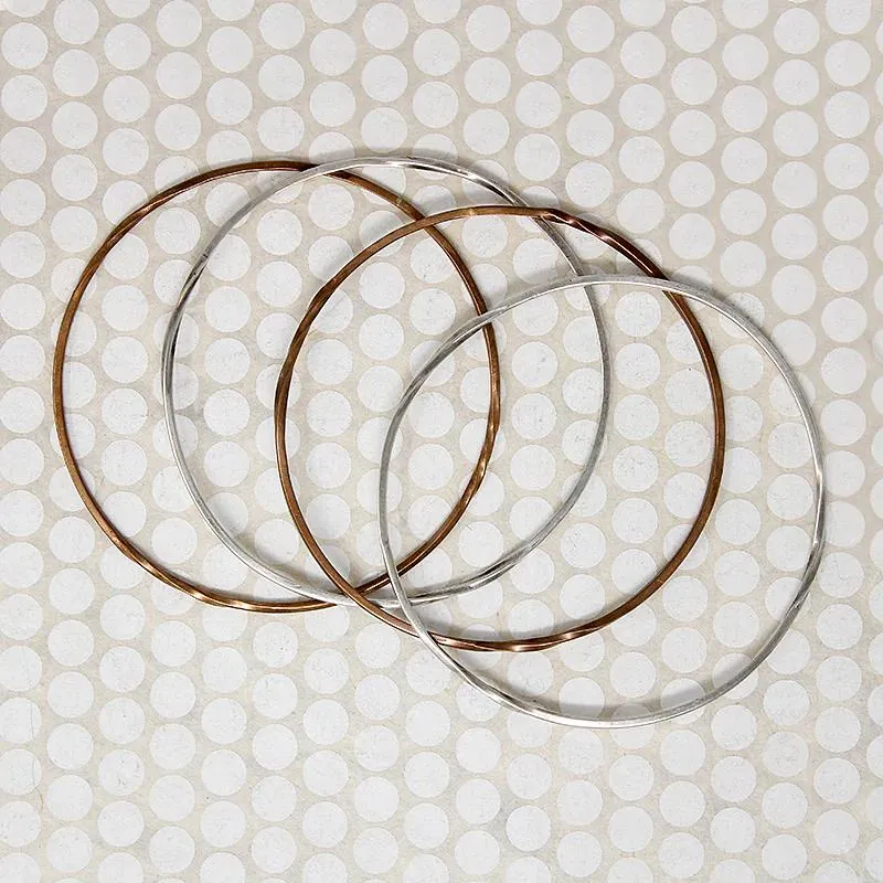 The Endless Twist Round Bangle in Sterling from Allie B.