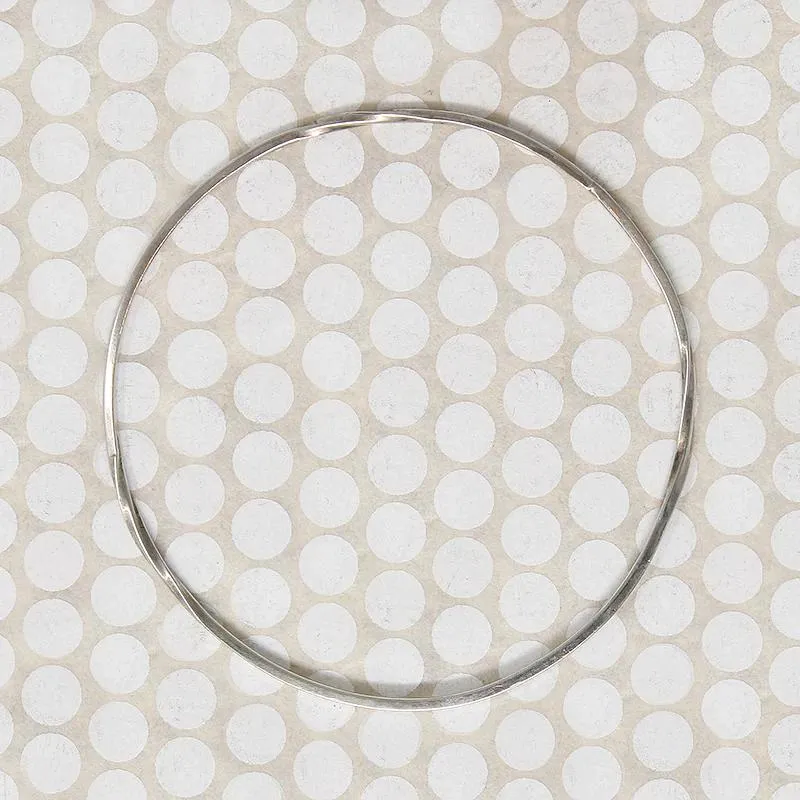 The Endless Twist Round Bangle in Sterling from Allie B.