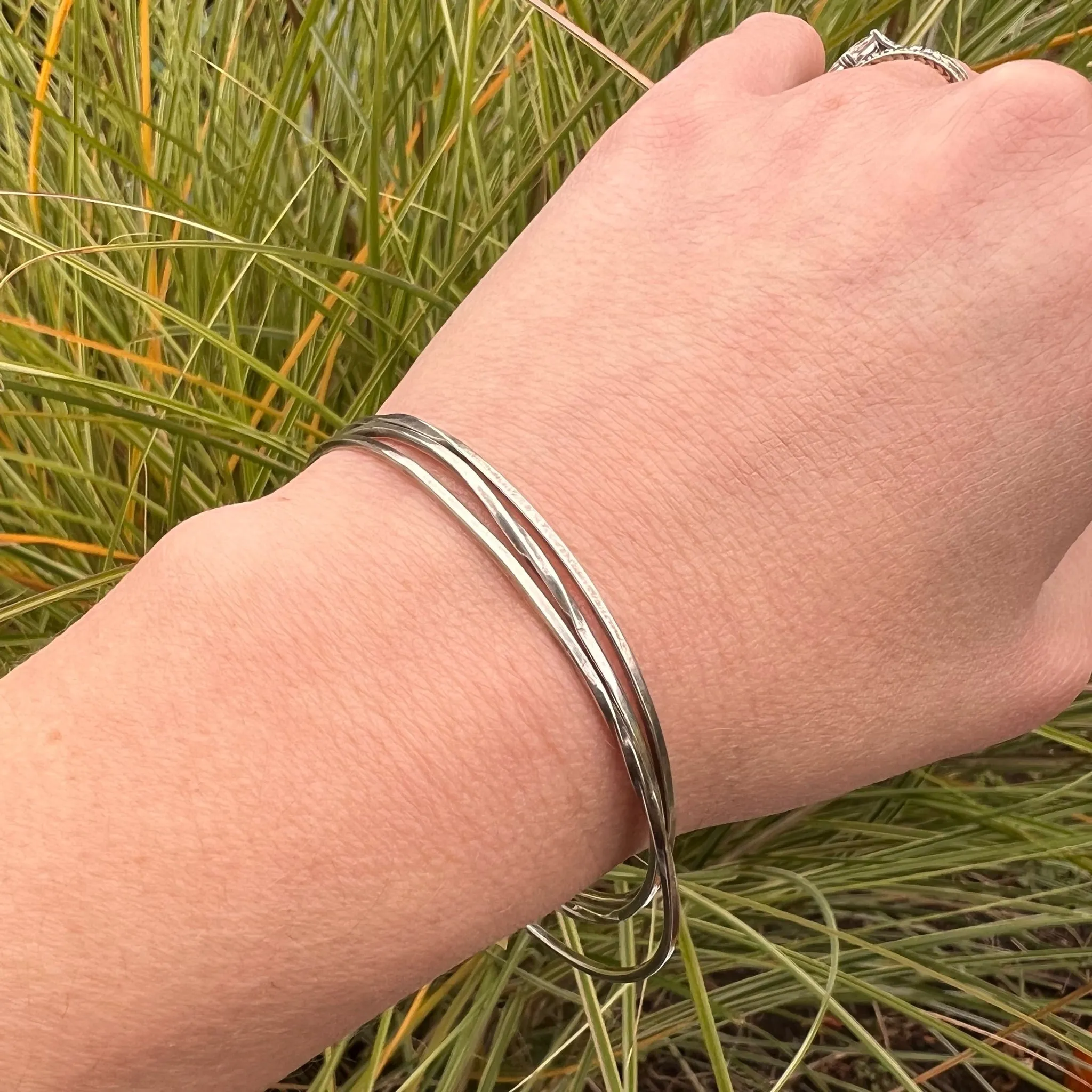 The Endless Twist Round Bangle in Sterling from Allie B.